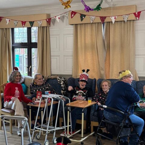 Residents enjoying chair pilates and pet therapy activities at Nightingale Care Home