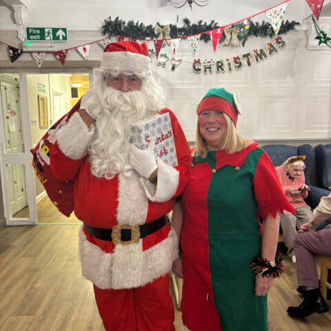 Residents, families and staff enjoying the Christmas Party at Nightingale Care Home