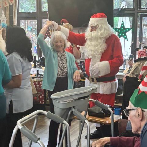 Residents, families and staff enjoying the Christmas Party at Nightingale Care Home