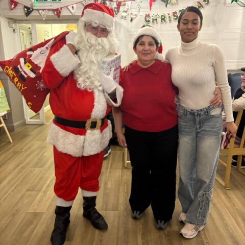 Residents enjoying festive social time during the Christmas party at Nightingale House