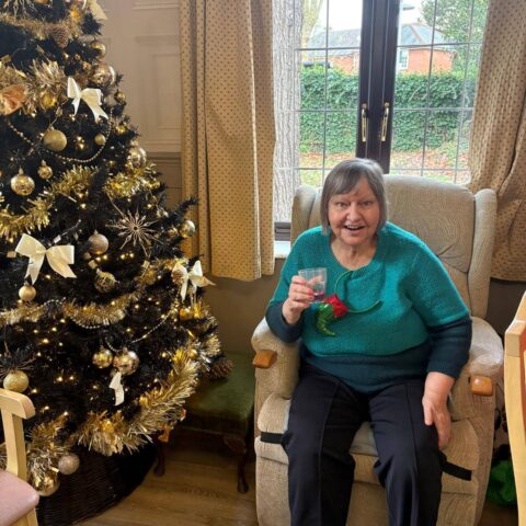 Residents enjoying festive company during the Christmas celebration at Nightingale House