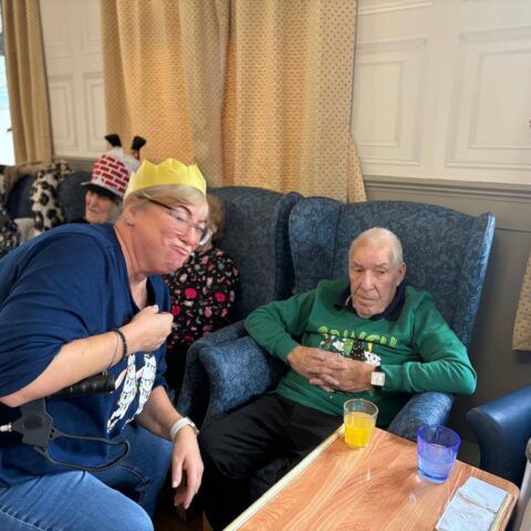 Residents sharing Christmas cheer during the festive celebration at Nightingale House