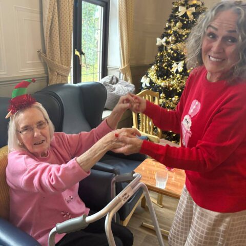 Christmas party moment with residents and visitors at Nightingale House