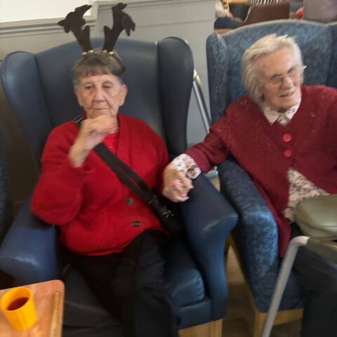 Residents and guests sharing a festive Christmas celebration at Nightingale House