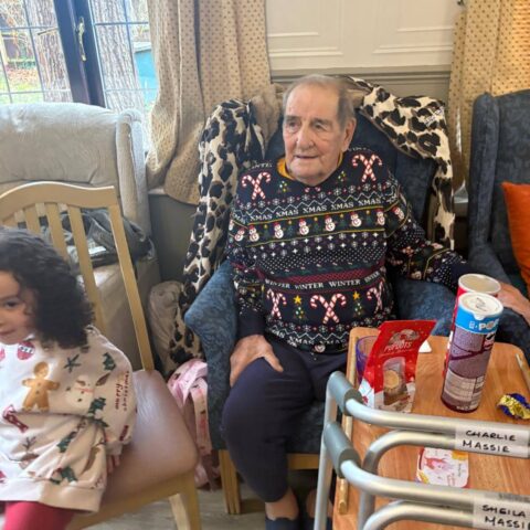 Residents and guests enjoying a festive Christmas celebration at Nightingale House