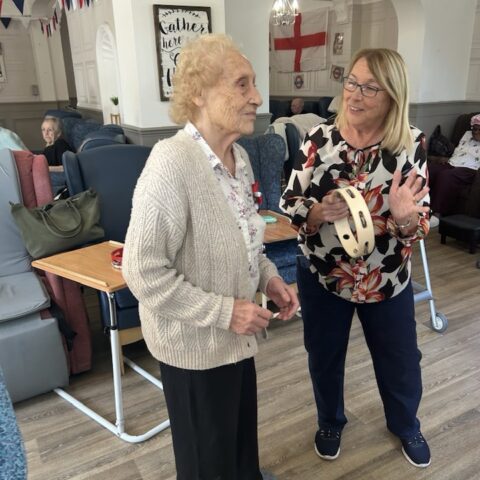 Residents enjoying circus entertainment during a special activity day at Nightingale Care Home