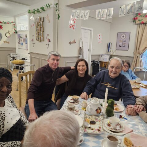 Residents enjoying the Mad Hatter’s Tea Party celebration at Nightingale House