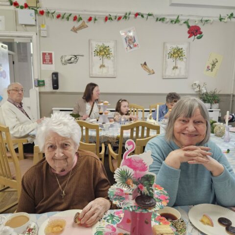Residents enjoying the Mad Hatter’s Tea Party celebration at Nightingale House