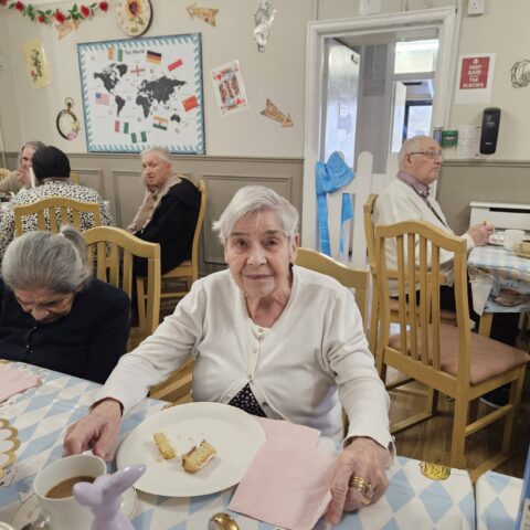 Residents and guests enjoying the Mad Hatter’s Tea Party at Nightingale House