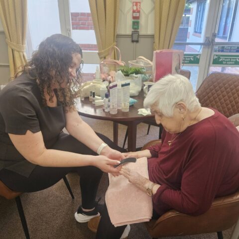 Resident enjoying a pamper session at Nightingale House