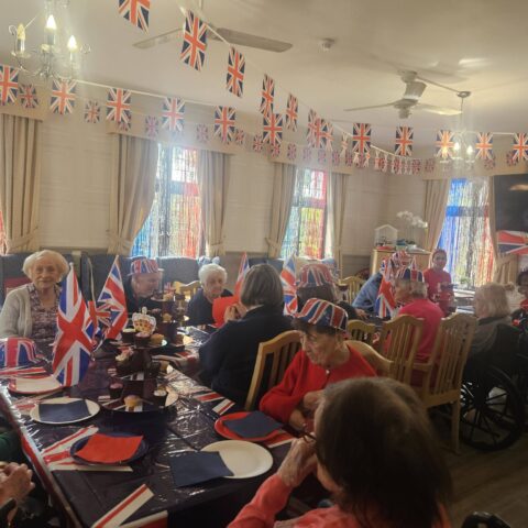 Residents and staff celebrating VE Day at Nightingale House