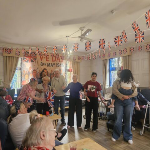 Residents and staff celebrating VE Day at Nightingale House
