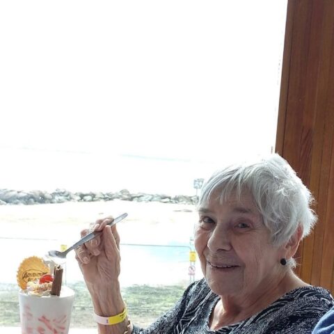 Resident enjoying an ice cream sundae during a Southend-on-Sea seaside outing